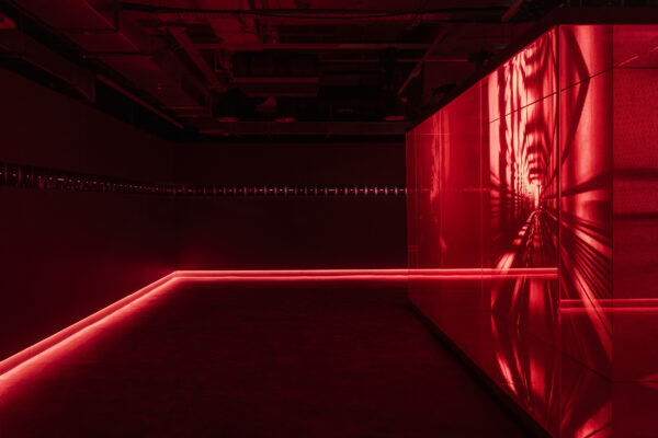 A red glass box structure installation