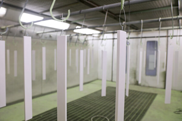 Materials hanging in paint booth