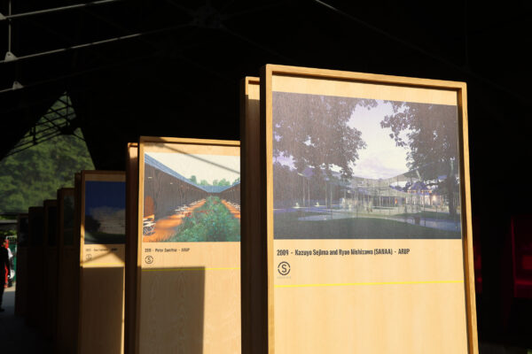 Boards displaying images of previous Serpentine Pavilion designs