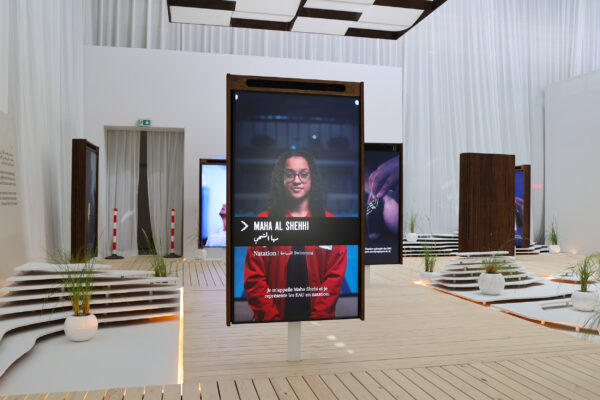 Large presenter screens introducing UAE athletes