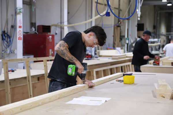 People working in woodshop