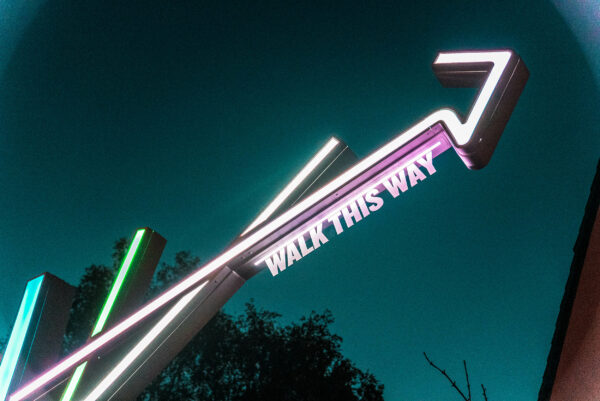 Close up image of illuminated wayfinding sign at night