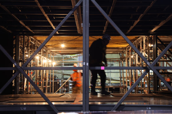 Image of workers under stage