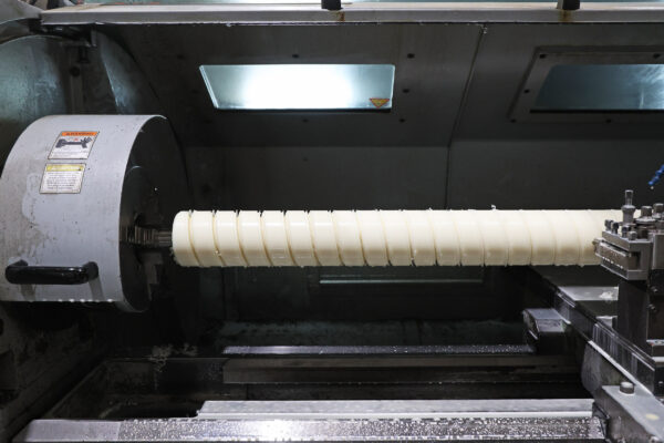 Image of nylon scroll on turning machine during manufacture